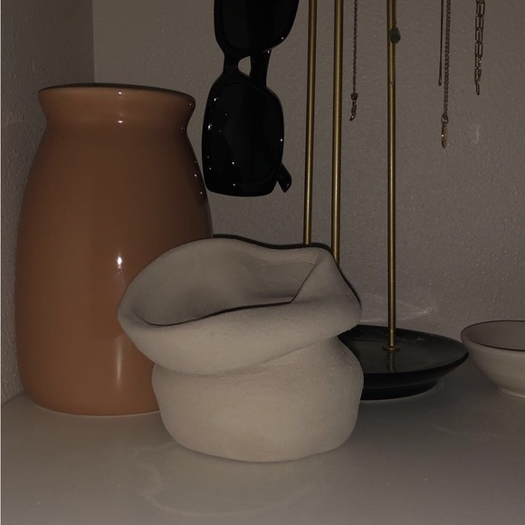 This is a cream white piece made with clay for decor around your house. - Picture 1 of 2